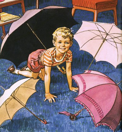Niño jugando con paraguas de English School