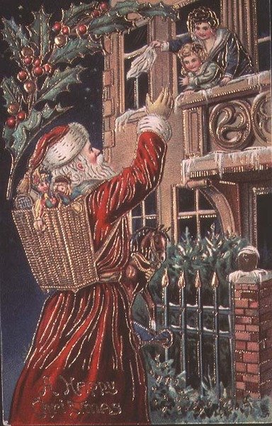 Papá Noel saludando a una madre y un niño de English School