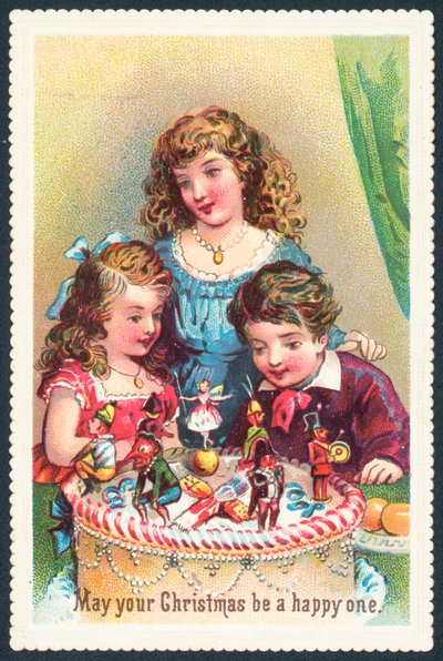 Dama y niños admirando pastel de Navidad de English School