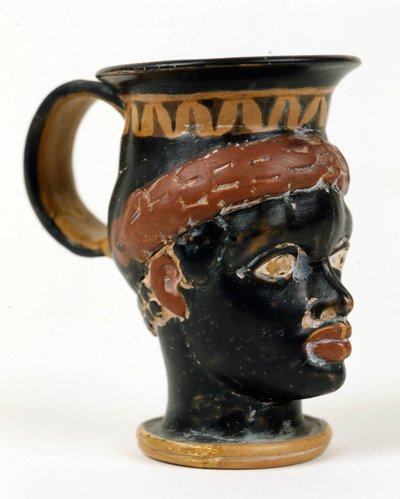 Vaso etrusco en forma de cabeza de hombre negro. Museo Nacional de Tarquinia. de Etruscan Etruscan