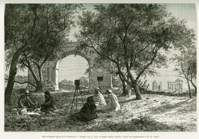 Bab-er-Roumia (Bab er Roumia), puerta de la mujer cristiana, ruinas romanas en Dougga, picnic de viajeros y sus guías, alrededor de una cámara. Grabado por Eugène Girardet, para ilustrar la historia Viaje en Túnez, por R. Cagnat y H. Saladin, encargados de de Eugene Alexis Girardet