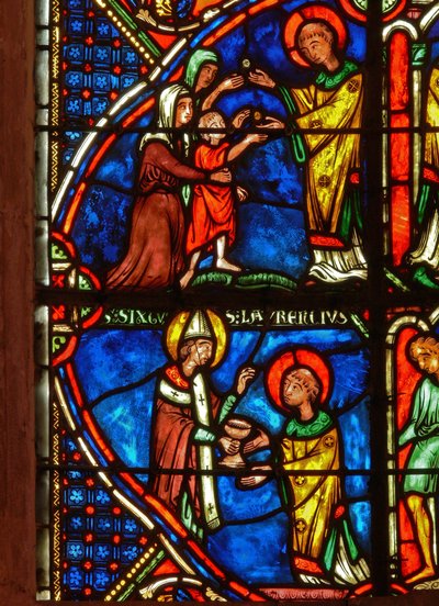 (detalle) de una ventana que representa escenas de la vida de San Lorenzo de French School