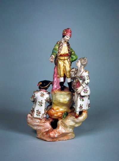 Estatuilla de cuatro personas agrupadas en una rocalla (faience) de French School