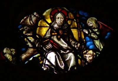 La ventana rosa oeste que representa una escena del Libro de Apocalipsis: el libro es dado al cordero (5:6) de French School