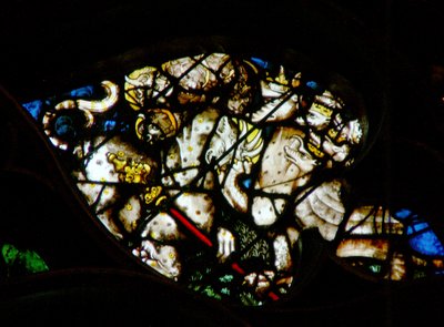 La ventana rosa oeste que representa una escena del Libro de Apocalipsis: el dragón da poder y autoridad a la bestia (13:2-3) de French School