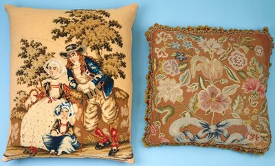 Dos cojines con paneles de bordado trabajados en sedas y lanas de colores de French School