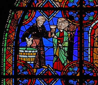 Peregrinos en la tumba de San Julián de Brioude donde se distribuye vino de French School