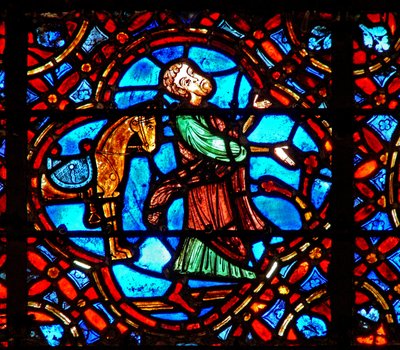 Ventana w12 que representa una escena en la ventana del Buen Samaritano: el Samaritano se baja de su caballo de French School