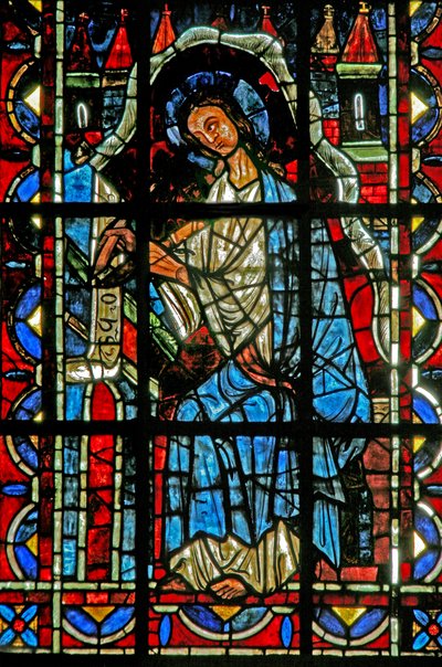 Ventana w202 que representa a San Juan escribiendo el Evangelio de French School