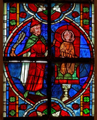 Ventana w209 que representa la estatua de San Nicolás (ante la cual a menudo se arreglaban tratos sobre préstamos de dinero): un judío habiendo perdido dinero golpea la estatua de French School