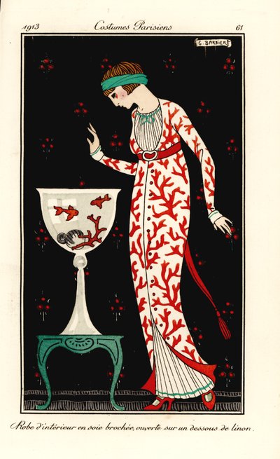 Mujer con vestido de casa de seda con estampado de coral sobre una enagua de lino. Acuario con coral y peces de colores. Bata de casa en seda brocada, sobre una enagua de lino. Grabado pochoir (stencil) coloreado a mano según una ilustración de George Barb de Georges Barbier