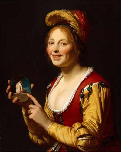 Niña sonriente, cortesana, sosteniendo una imagen obscena de Gerrit van Honthorst