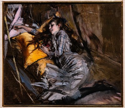 Niña reclinada con vestido de tartán de Giovanni Boldini