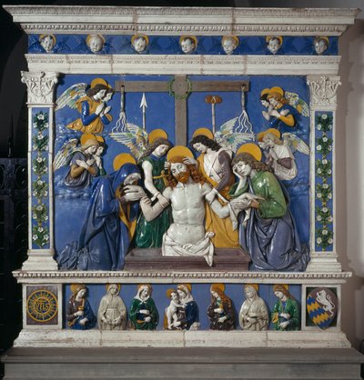 La Deposición de Jesús en el Santo Sepulcro con la Virgen y San Juan Evangelista. Representación de símbolos de la Pasión: látigos, corona de espinas y esponja empapada en vinagre (posca). Alto relieve cerámico por Giovanni della Robbia (1469-1529) de Giovanni della Robbia