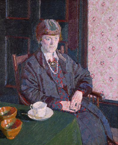 Mujer sentada en una mesa de Harold Gilman