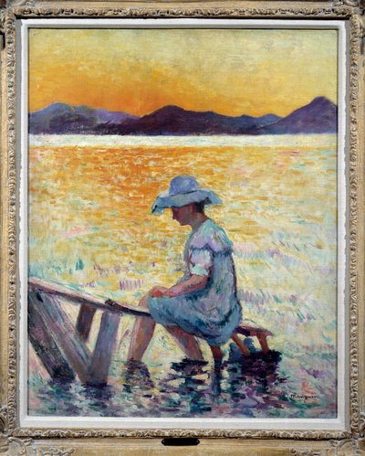 Saint Tropez, puesta de sol Una mujer sentada con los pies en el agua en la orilla de Henri Charles Manguin