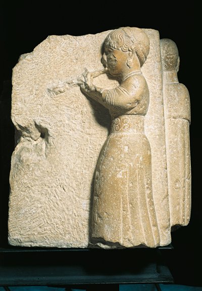 España, Osuna (Urso), bajorrelieve que representa a un tocador de aulos de Iberian
