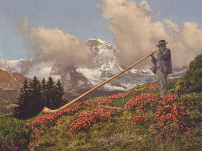 Suiza: Un soplador de Alphorn, la Jungfrau al fondo (foto en color) de Jean Gaberell