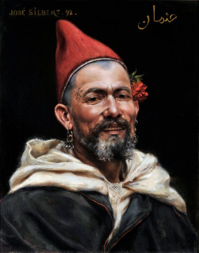 Cabeza de marroquí Retrato de hombre con orejas perforadas y sombrero rojo, con una flor en la oreja y un tatuaje en la sien 1892 (pintura) de Jose Silbert