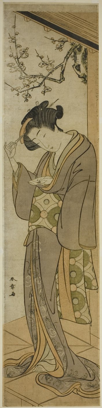 Mujer en una veranda a punto de abrir una carta de Katsukawa Shunsho