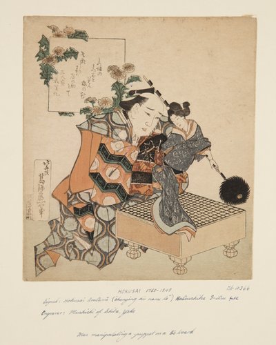 Titiretero Sosteniendo Marioneta en un Tablero de Go de Katsushika Hokusai