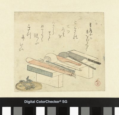 Utensilios de cocina en una tabla para picar de Kubota Shunman