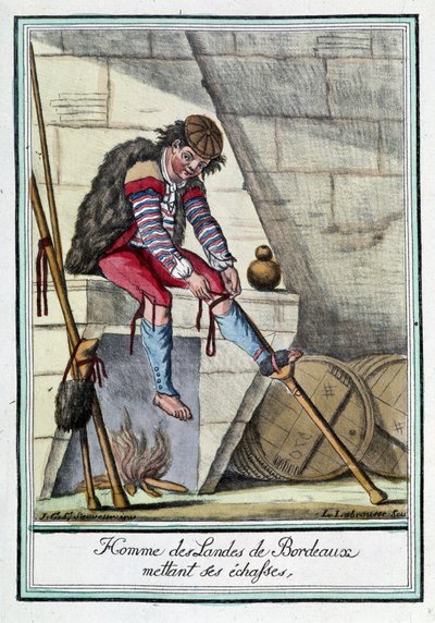 Hombre de los Páramos de Burdeos poniéndose los zancos de L.F. Labrousse