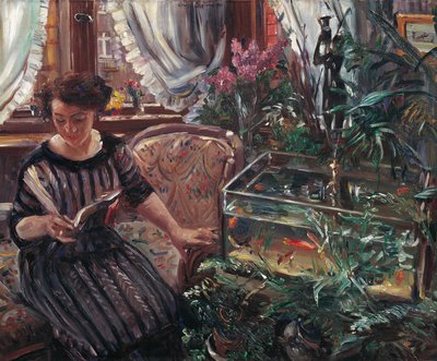 Una mujer leyendo cerca de un tanque de peces dorados, 1911 de Lovis Corinth