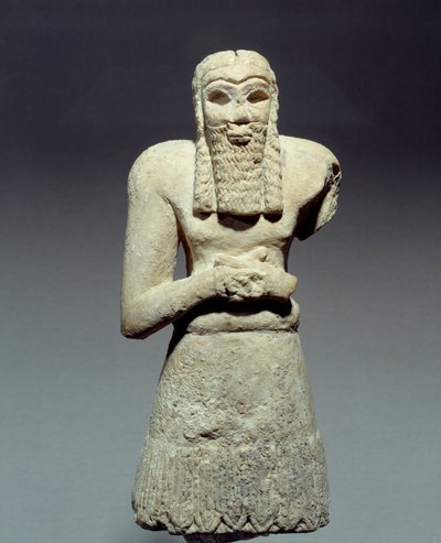 Antigüedades orientales: estatuilla en piedra caliza de orante dedicada al Príncipe Ginak. Mesopotamia. 2750 a.C. París, Museo del Louvre de Mesopotamian Mesopotamian
