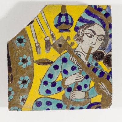 Azulejo de cerámica cuerda seca de finales del siglo XVII de Persia safávida que representa a un hombre tocando una flauta con un turbante de Persian School