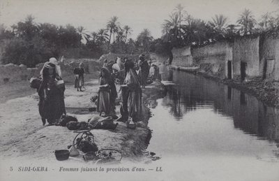 Mujeres recogiendo agua en Sidi-Okba, Argelia de Photographer French