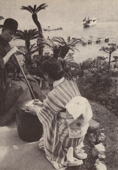 Empresario japonés y su secretaria tomando notas taquigráficas de Photographer Japanese