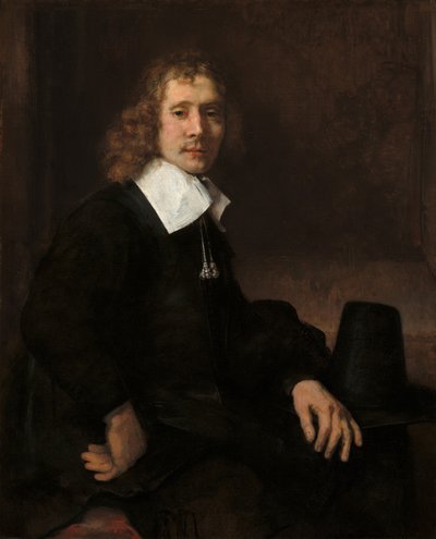Un joven sentado en una mesa (posiblemente Govaert Flinck) de Rembrandt van Rijn