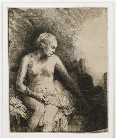 Una mujer en el baño con un sombrero a su lado, 1658 de Rembrandt van Rijn