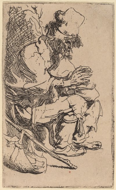 Mendigo sentado calentando sus manos en un brasero de Rembrandt van Rijn