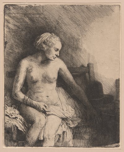 Mujer en el baño con un sombrero a su lado de Rembrandt van Rijn