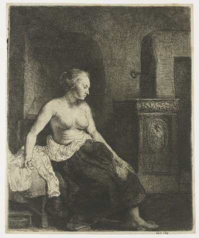 Mujer sentada a medio vestir junto a una estufa de Rembrandt van Rijn