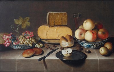 Queso en un plato de plata, uvas rojas y blancas y manzanas en cuencos de porcelana Wanli, panecillos, un cuchillo y una manzana cortada en un plato, todo sobre una mesa con mantel, 1626 de Roloef Koets