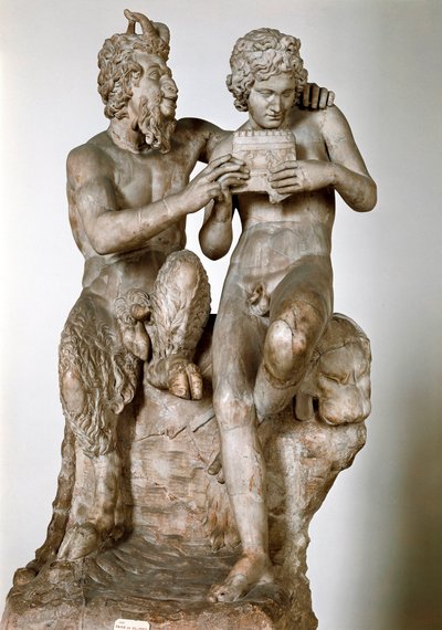 Estatuilla del dios Pan enseñando a tocar la flauta a su erómeno, el pastor Daphnis. Escultura romana de mármol del siglo I a.C. después de un original griego. Museo Arqueológico Nacional de Nápoles de Roman