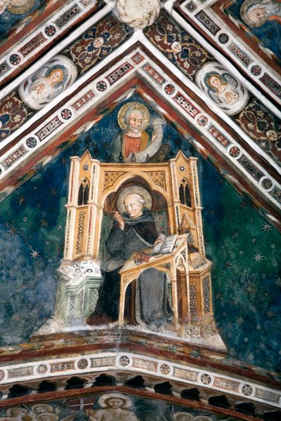 Vista del detalle de un fresco que decora una de las bóvedas de la Iglesia Superior que representa a los cuatro doctores de la Iglesia Romana: San Jerónimo y el evangelista San Lucas. realizado por la escuela de Siena a principios del siglo XIV. Monasterio de Sienese School