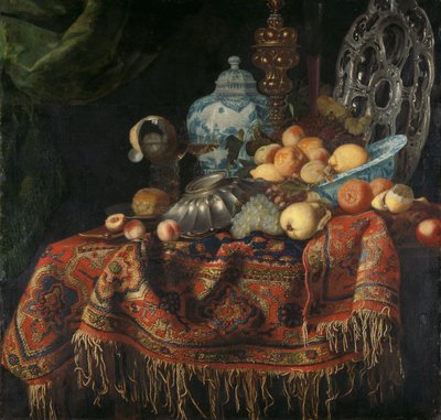 Bodegón con fruta, platos y vajilla sobre una alfombra de pavo de Simon Luttichuys (attributed to)