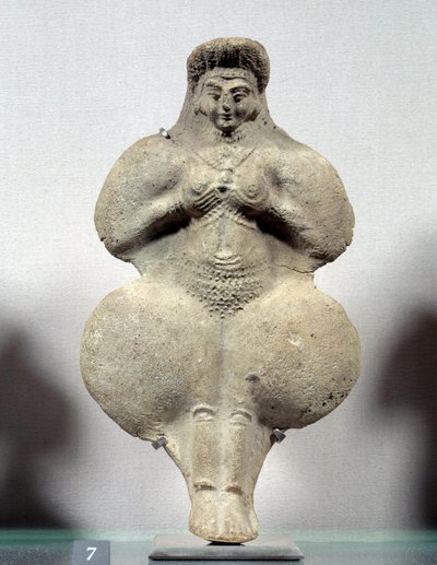 Arte oriental: estatuilla de terracota de mujer sosteniendo sus pechos, probable representación de Ishtar, diosa de la fertilidad. De Susa. Irán. Período elamita. Siglos XIV-XII a.C. Altura 0,16 m. Museo del Louvre de Sumerian Sumerian