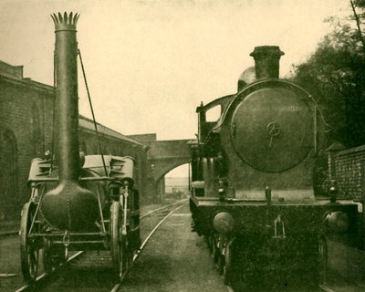 Un modelo a tamaño real del Rocket de Stephenson junto a una locomotora de la clase George the Fifth, Londres de Unbekannt