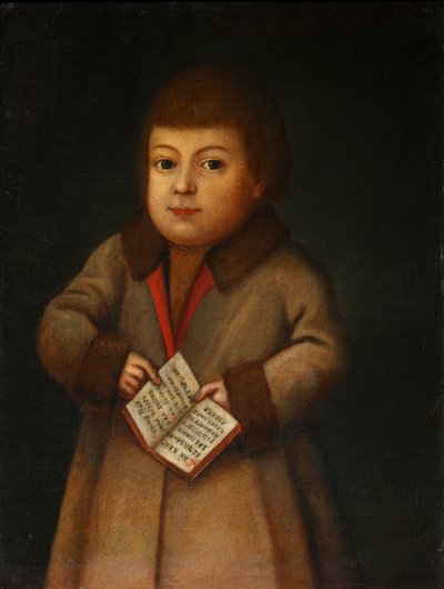 Niño con un libro de alfabeto de Unbekannt