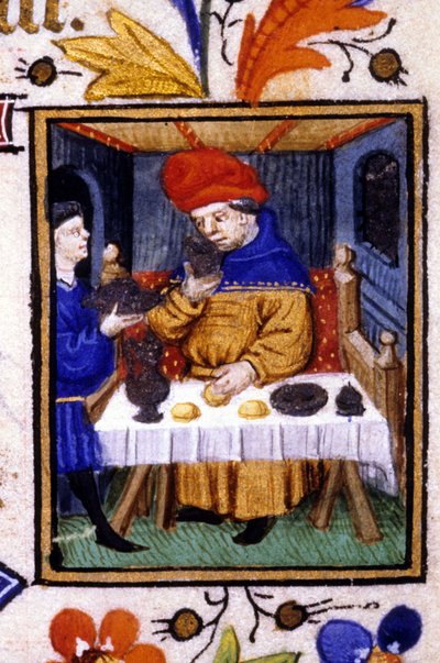 Representación del mes de enero. Un sirviente pone comida en la mesa de su amo. Miniatura de un manuscrito del siglo XIV. de Unknown artist