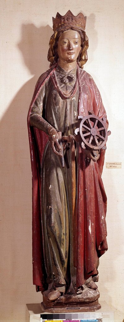 Representación de Santa Catalina de Alejandría, sosteniendo el instrumento de rueda de su tormento. Estatua de madera policromada de Unknown artist