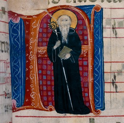 La letra A con una representación de San Benito: f.70r de un Antifonario de Unknown