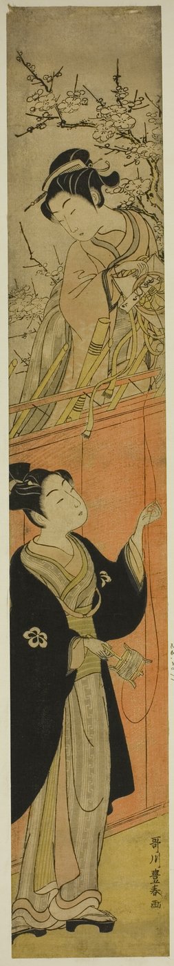 Joven hombre y mujer con una cometa de Utagawa Toyoharu