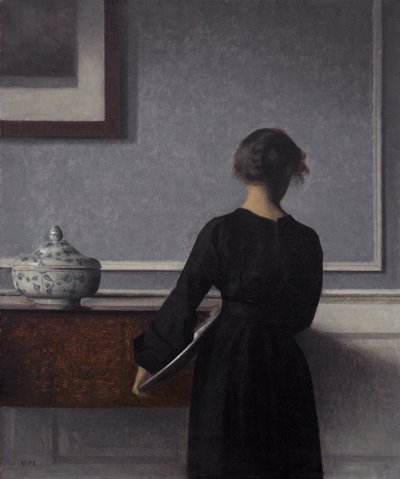 Interior con joven de espaldas de Vilhelm Hammershøi