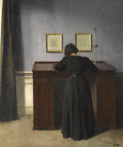 Ida de pie en un escritorio, 1900 de Vilhelm Hammershoi